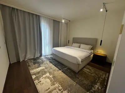 a bedroom with a bed and a large window at Private Somabay Villa with Pool in Hurghada