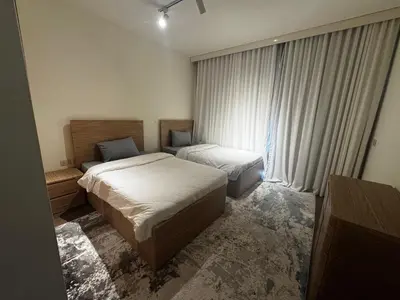 a hotel room with two beds and a window at Private Somabay Villa with Pool in Hurghada