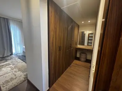 a hallway leading to a bedroom with a wooden door at Private Somabay Villa with Pool in Hurghada