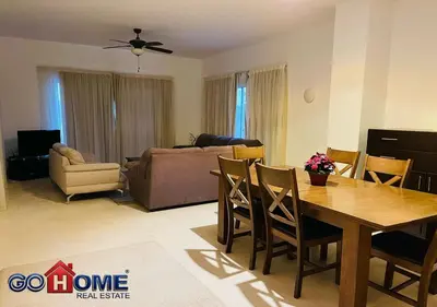 a living room with a table and a couch at Spacious Villa 4 Broom Private Pool V35 at White villa in Hurghada