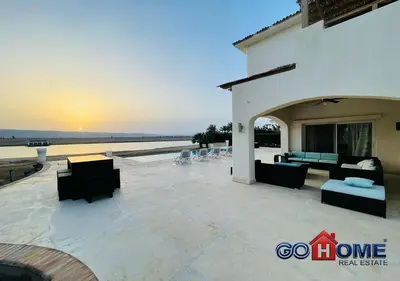a patio with couches and chairs in front of a building at Spacious Villa 4 Broom Private Pool V35 at White villa in Hurghada