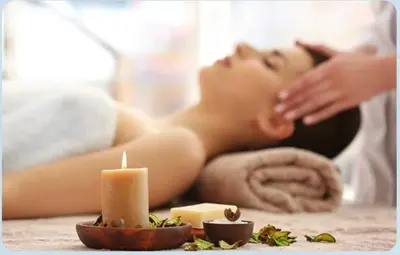 a woman laying in a spa with a candle at Royal Jade wellness luxurios Dahabiya Nile Cruise Every Monday from Luxor to Aswan 4 nights and Every Friday from Aswan to Luxor 3 nights in Luxor
