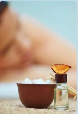 a small bottle of oil and a bowl with a chip in it at Royal Jade wellness luxurios Dahabiya Nile Cruise Every Monday from Luxor to Aswan 4 nights and Every Friday from Aswan to Luxor 3 nights in Luxor