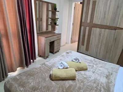 a bedroom with a bed with towels on it at Do wynajęcia apartament w Hurghadzie w resorcie Aqua Tropical in Hurghada