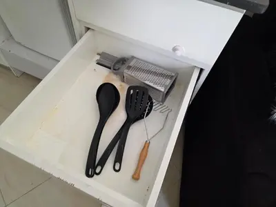 a drawer with utensils in a white box at Do wynajęcia apartament w Hurghadzie w resorcie Aqua Tropical in Hurghada