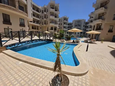 a swimming pool in the middle of a building at Do wynajęcia apartament w Hurghadzie w resorcie Aqua Tropical in Hurghada