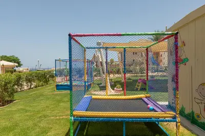 a playground with three trampolines in a yard at Spacious sea view ,1 bedroom apartment in Azzurra Sahl Hasheesh in Hurghada