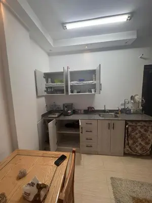 a kitchen with a sink and a counter top at Florenza Khamasin C105 in Hurghada