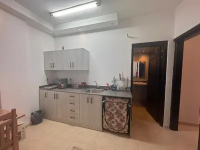 a kitchen with a sink and a counter top at Florenza Khamasin C105 in Hurghada