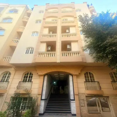 a building with a staircase in front of it at Alisra Hurghada Building in Hurghada
