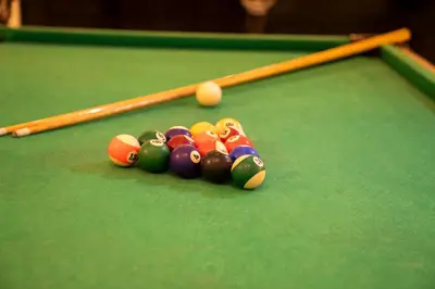 a group of billiard balls on a pool table at Roma Hotel in Hurghada