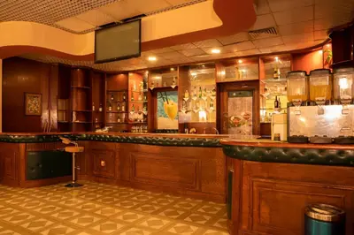 a bar in a restaurant with a counter at Roma Hotel in Hurghada