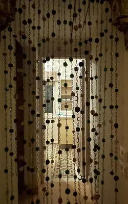 a window with a bunch of necklaces hanging from it at El Gouna Villa Upper-Nubia, Sleeps 4-6 Persons in Hurghada