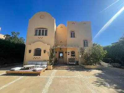 a large building with pillows in front of it at El Gouna Villa Upper-Nubia, Sleeps 4-6 Persons in Hurghada
