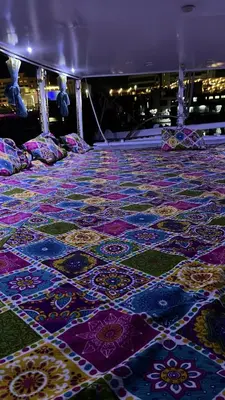 a room with a floor covered in colorful tiles at Assuan Felucca in Aswan