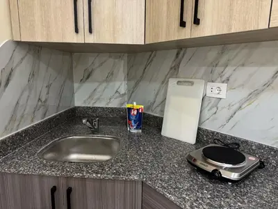 a kitchen counter with a sink and a toaster at La Quinta Hurghada Pool & Sea View Ground floor in Hurghada