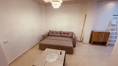 a living room with a couch and a table at Modern apartment for rent in Hurghada