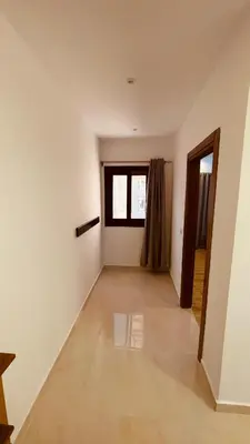 an empty room with white walls and a window at Modern apartment for rent in Hurghada