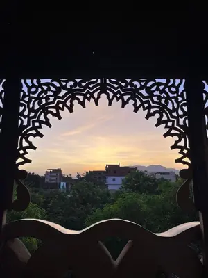 a view of a sunset through a window at Villa Harmony Luxor in Luxor