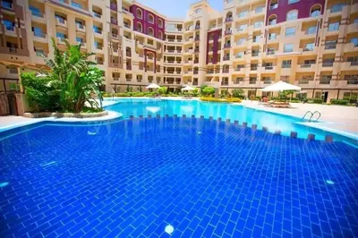 a large swimming pool in front of a building at Florenza compound in Hurghada