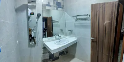a white bathroom with a sink and a mirror at isis MARINA in Hurghada