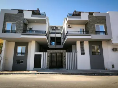 a building with balconies on the side of it at Hurghada Chill Out Home in Hurghada