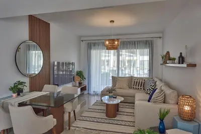 a living room with a couch and a table at Modern 3BR Poolside Apt at Cribs El Gouna in Hurghada