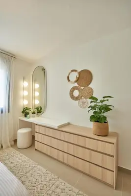 a bedroom with a vanity with a mirror and a plant at Modern 3BR Poolside Apt at Cribs El Gouna in Hurghada