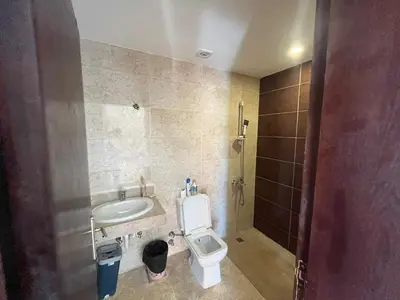 a bathroom with a toilet and a sink at Mirage Bay Aqua Park Apartments in Hurghada