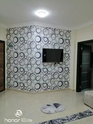 a wall with a flat screen tv on a wall at La quinta hights in Hurghada