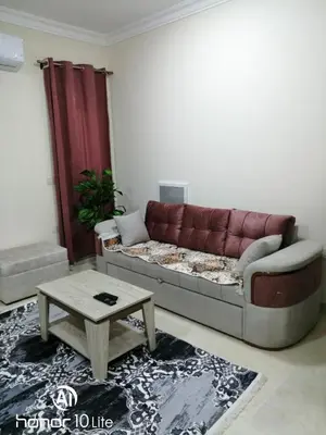 a living room with a couch and a coffee table at La quinta hights in Hurghada
