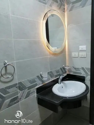 a bathroom with a sink and a mirror at La quinta hights in Hurghada