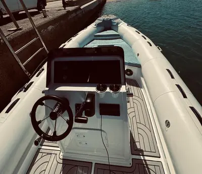 a boat with a steering wheel in the water at Wave Dancer in Hurghada