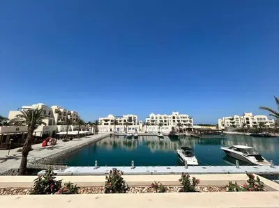 a view of a marina with boats in the water at Fanadir Marina 2BR GF • Stunning View in Hurghada
