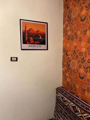 a picture hanging on a wall in a room at Aswan House center in Aswan