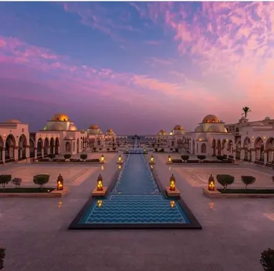 a courtyard of a building with a fountain at Tawaya Sea View 2 bedrooms in Hurghada