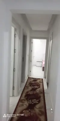 an empty hallway with a rug in the middle of a room at Fanadir Bay Elnoras213 Hurghada in Hurghada