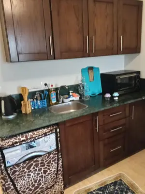 a kitchen counter with a sink and a microwave at Hurhgada concierge at Turtles beach resort in Hurghada