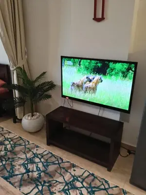 a flat screen tv sitting in a living room at Hurhgada concierge at Turtles beach resort in Hurghada