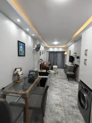 a living room with a couch and a table at Oasis Resort Compound in Hurghada