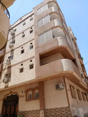 a tall building with a lot of windows at Essa Apartment in Safaga