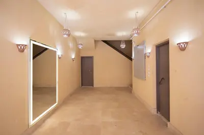 an empty hallway with a mirror and lights at Bayt Hassan S2 - Cosy 1 bedroom apartment in Hurghada