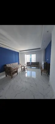 a room with two benches and a blue wall at Fanadir bay resort in Hurghada