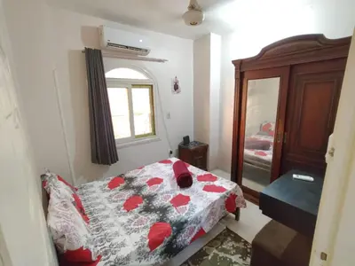 a bedroom with a bed with a quilt on it at flat in Hurghada Sheraton Metro street in Hurghada