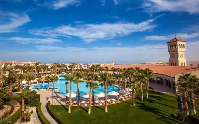 an aerial view of a resort with a clock tower at Luxurious Cozy studio in Sahl Hasheesh Hurghada in Hurghada