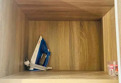 a bluesaw sitting on a shelf in a wooden drawer at Luxurious Cozy studio in Sahl Hasheesh Hurghada in Hurghada