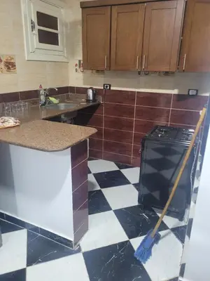 a kitchen with a black and white checkered floor at Hurghada down town in Hurghada
