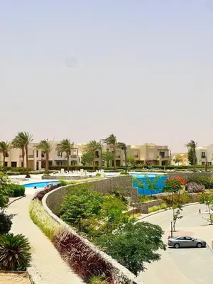 arial view of a resort with a swimming pool at Sea View Serenity - Stylish 2BR Retreat in Hurghada