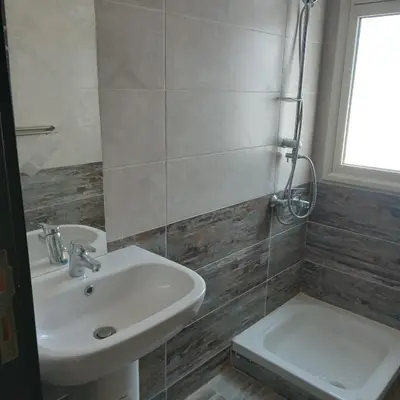 a bathroom with a sink and a toilet at George Villa in Hurghada