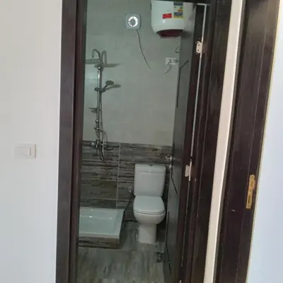 a bathroom with a toilet and a shower at George Villa in Hurghada